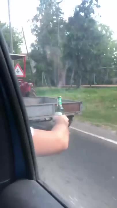 Just some dudes offering a cold one to a farmer on a hot day